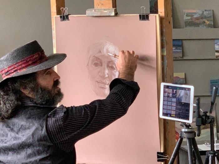 Photograph of artist Alexey Steele drawing subject Janet Hoult in live stream session October 2020
