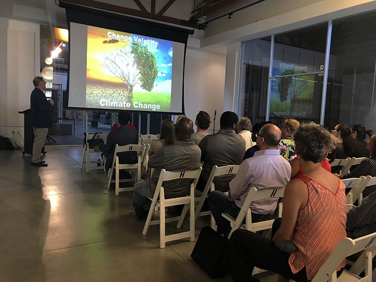 Speaker Series event on 'Innovation in Urban Design.' July 17, 2019. The event speaker, Gerhard Mayer, presents the event's slideshow.