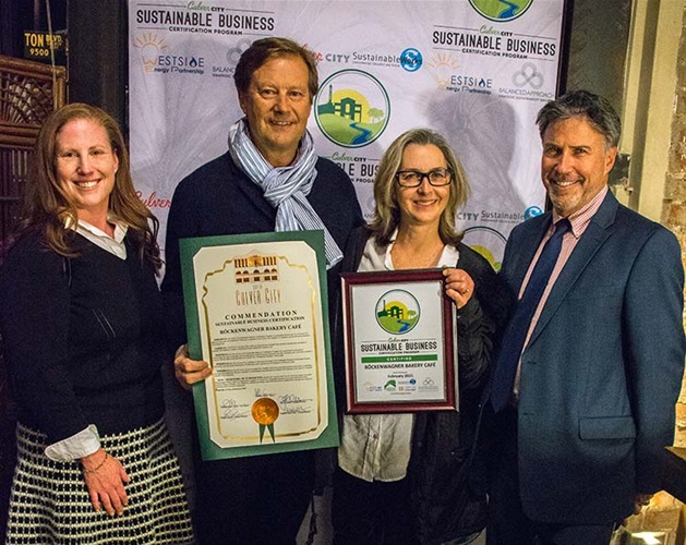 Mayor Jeff Cooper presenting Sustainable Certificate to Rockenwagner's Bakery Cafe