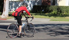 Photograph of bicyclist wearing red shirt