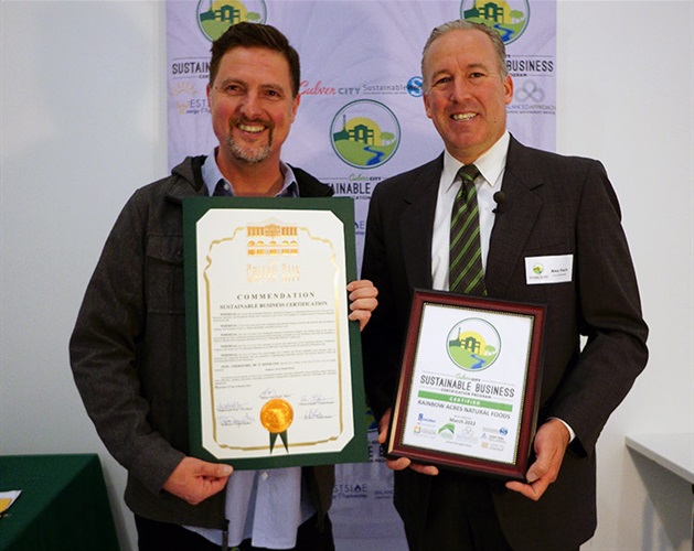 Council Member Alex Fisch presenting Sustainable Certificate to Rainbow Acres
