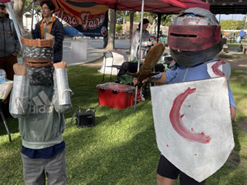 Two Hero Faire Participants In Costume