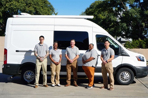 Mobile Crisis Team stands in front of white van