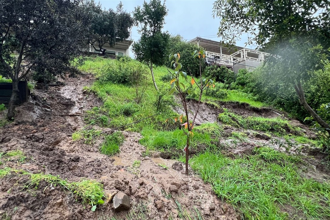 Photo of mud forming behind homes in the Culver Crest area.