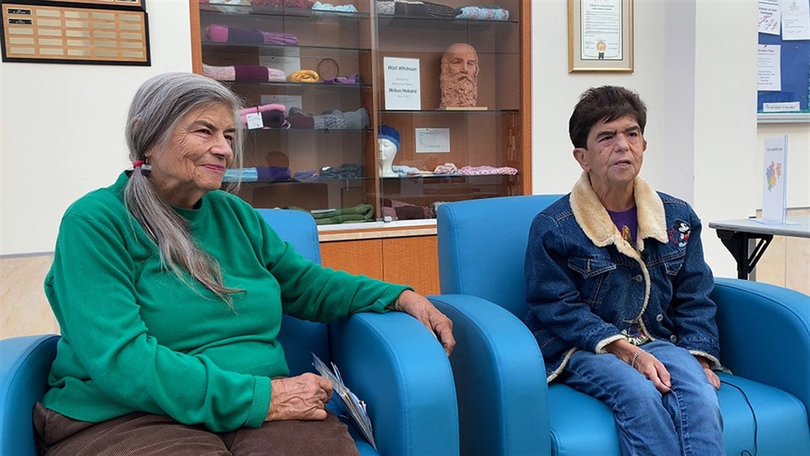 Linda and Laura sit together in the Culver City Senior Center