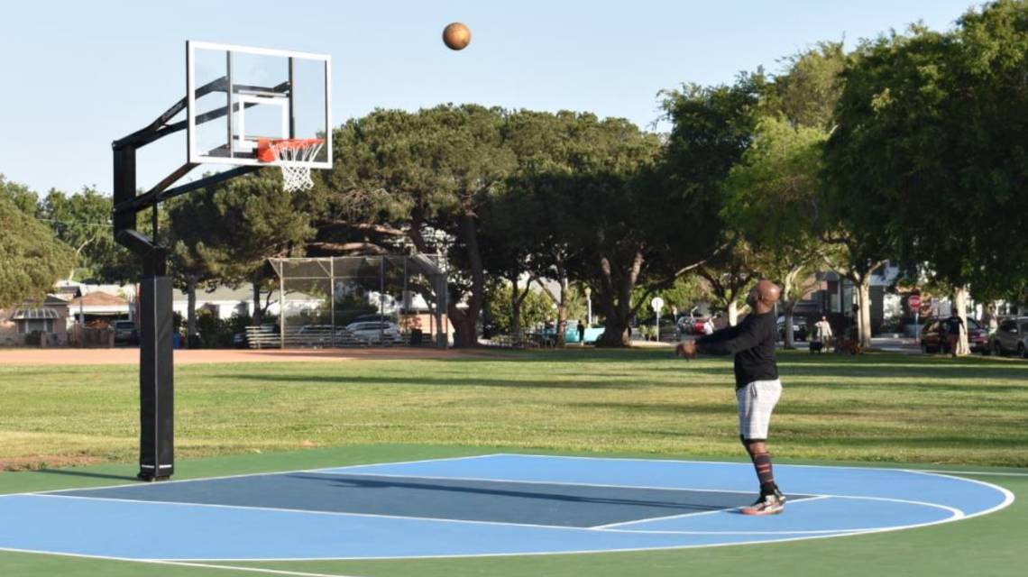 One Man Playing Basketball at Vets Park