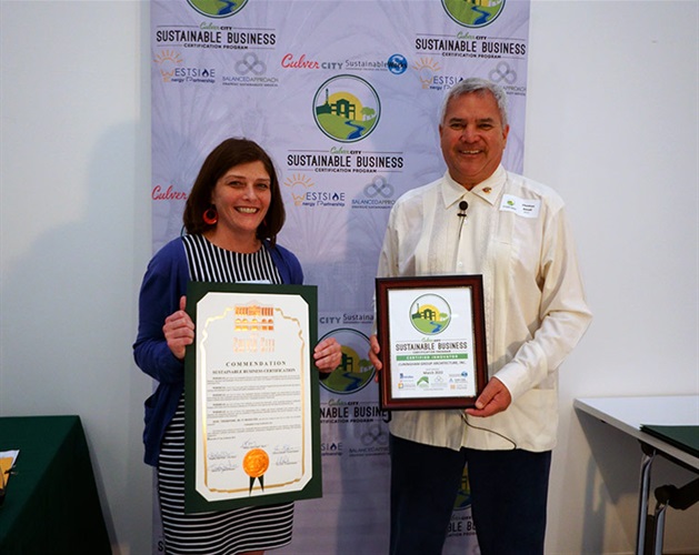 Mayor Thomas Small presenting Sustainable Certificate to Cuningham Group