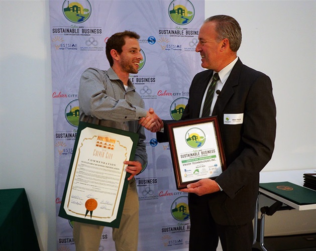 Council Member Alex Fisch presenting Sustainable Certificate to Envoy