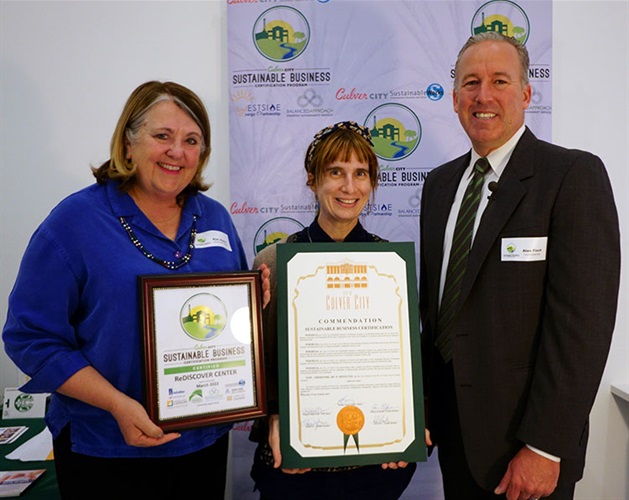 Council Member Alex Fisch presenting Sustainable Certificate to Rediscover Center