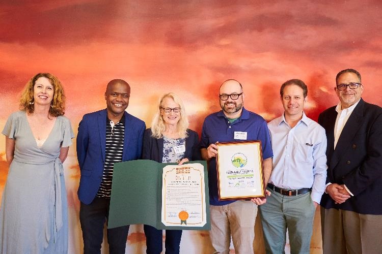 Photograph of Mayor Daniel Lee and representatives from TempleAkiba receiving Sustainable Business Certificate at event June 2022