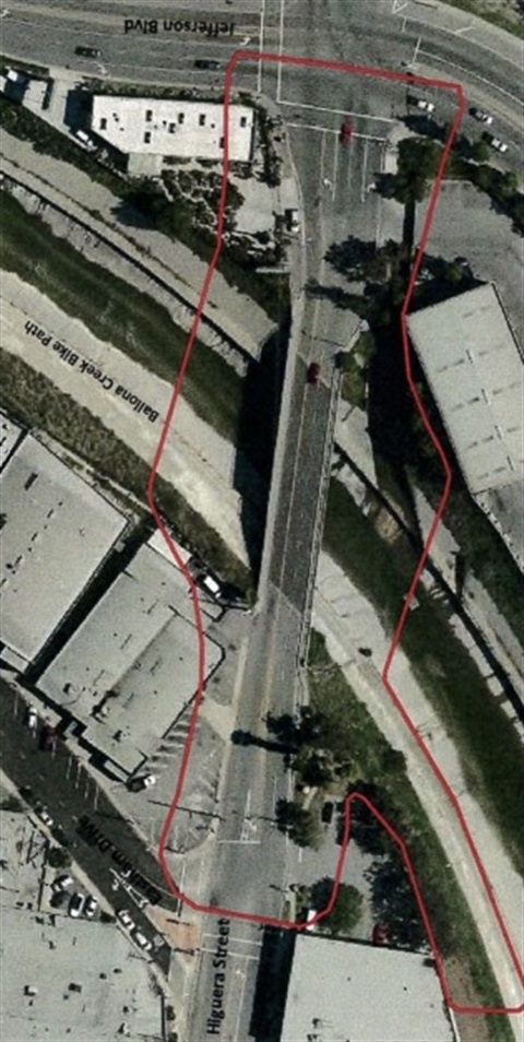 Photograph of ariel view of Higuera St bridge and surrounding buildings and intersecting streets Jefferson Blvd and Eastham Dr, as well as Ballona Creek below, 2021