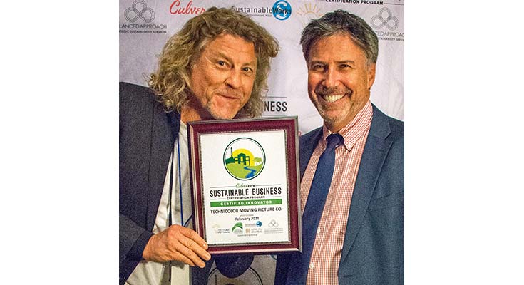Photograph of Mayor Jeff Cooper and representative from Technicolor Moving Pictures receiving Sustainable Business Certificate, 2017